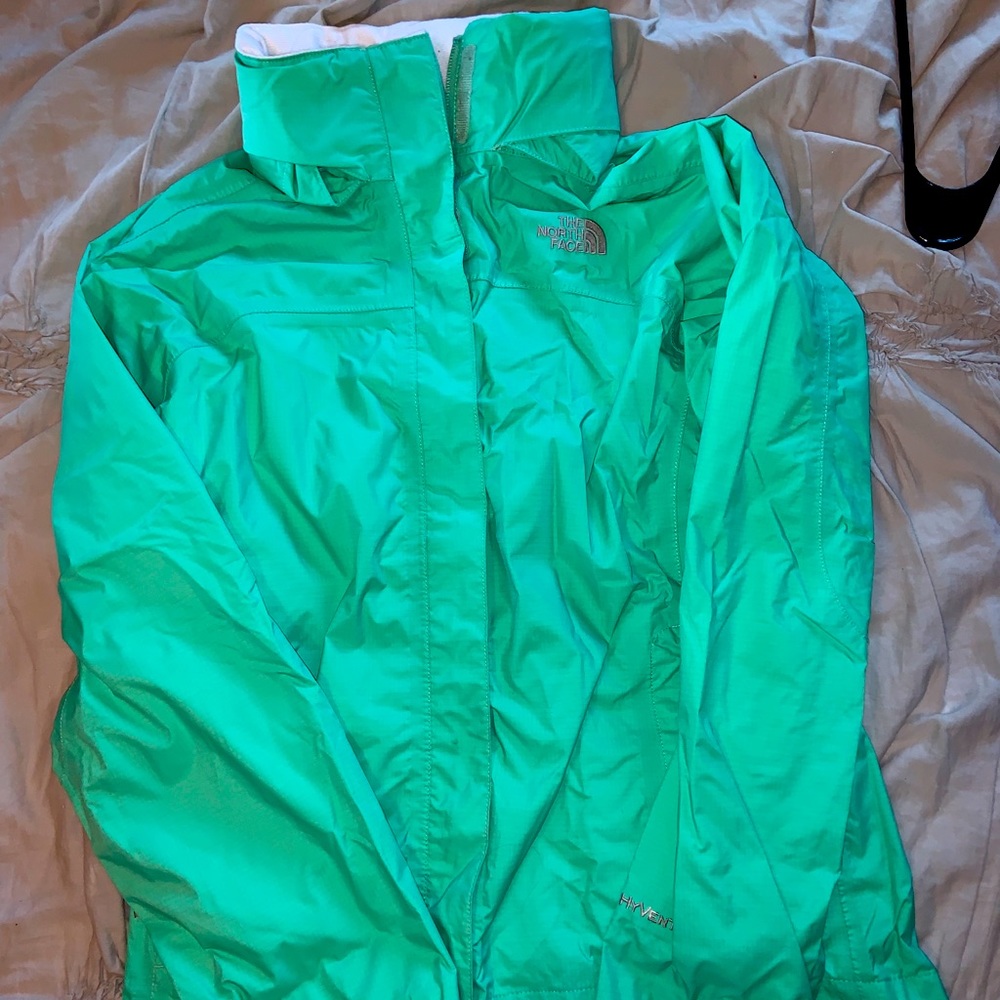 The North face rain jacket mint green youth size large. Like new.